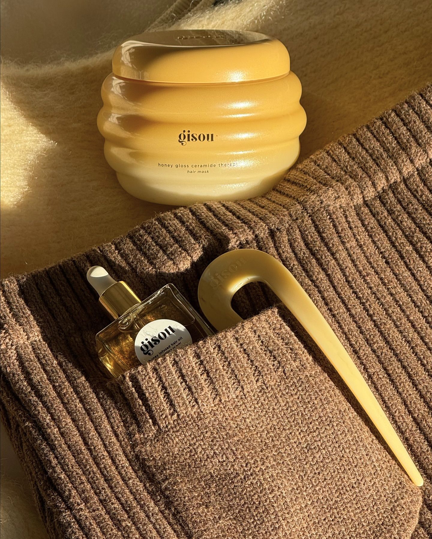 Branded merchandise created by Twelve for Gisou; custom hair pin